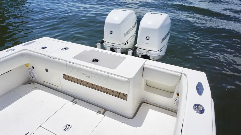 Slide: The Image of 2009 SeaVee 32OB boat with twin outboard engines on calm water. - 19