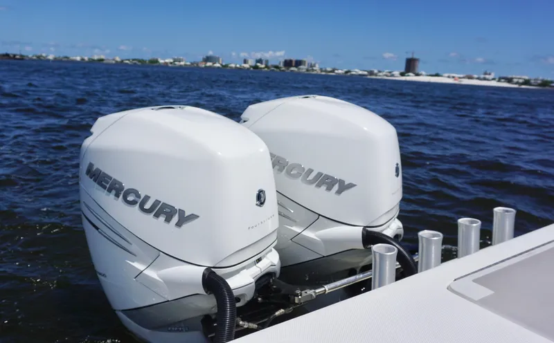 Slide: The Image of Twin Mercury outboard engines on a 2009 SeaVee 32OB boat, cruising on open water. - 23