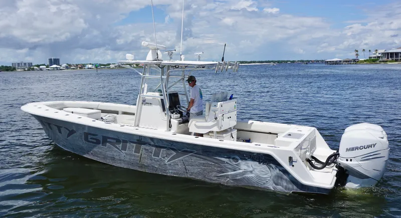 Slide: The Image of 2009 SeaVee 32OB boat on water, featuring Mercury engines and sleek design. - 4