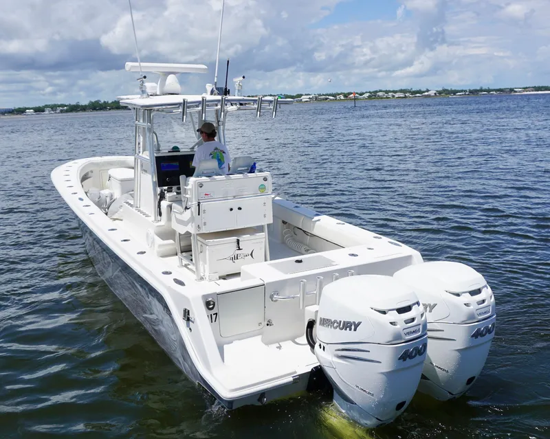 Slide: The Image of 2009 SeaVee 32OB boat with dual Mercury engines cruising on open water. - 6