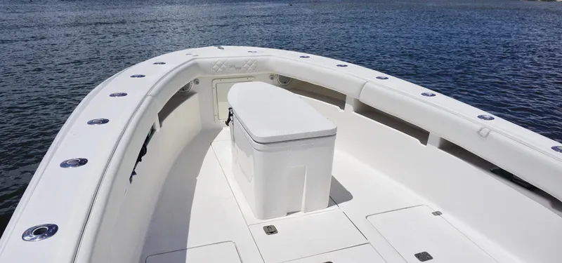 Slide: The Image of 2009 SeaVee 32OB boat deck with seating, on calm water. - 9