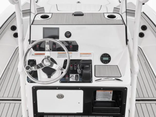 Slide: The Image of 2025 Yamaha Boats 195 FSH Sport dashboard with steering wheel and controls. - 8