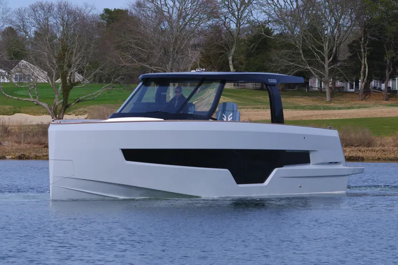 Slide: The Image of 2025 Fjord 41 XP yacht on calm water, modern design, sleek lines, and scenic background. - 12