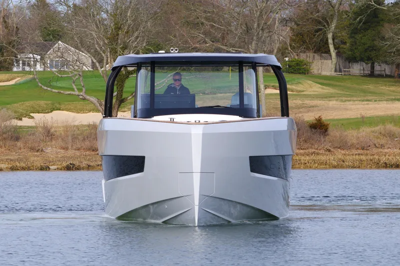 Slide: The Image of 2025 Fjord 41 XP yacht on calm water, front view, modern design. - 14