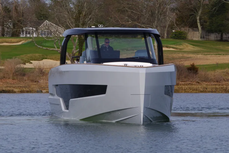 Slide: The Image of 2025 Fjord 41 XP boat on calm water, modern design, sleek lines. - 15