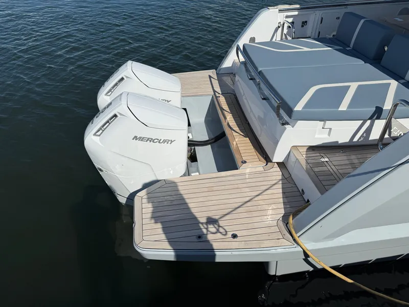 Slide: The Image of 2025 Fjord 41 XP boat with dual Mercury outboard engines on water. - 18