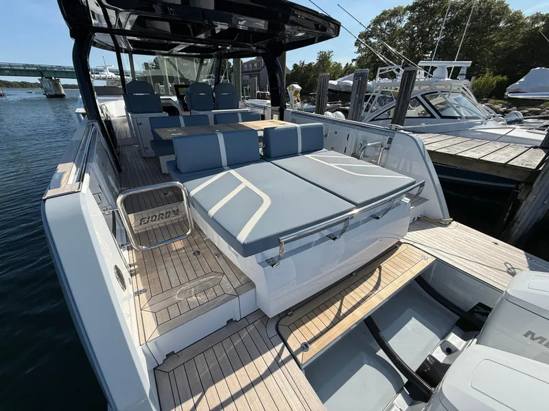 Slide: The Image of 2025 Fjord 41 XP luxury yacht with spacious deck and modern seating. - 21
