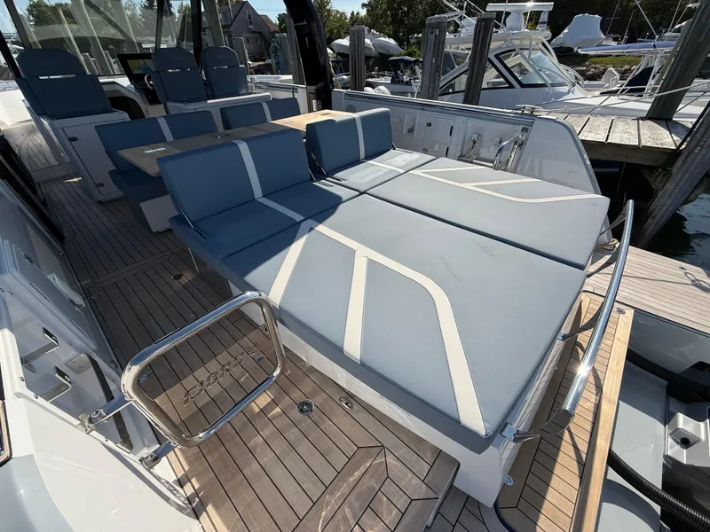 Slide: The Image of Luxurious 2025 Fjord 41 XP yacht with spacious deck seating and modern design. - 23