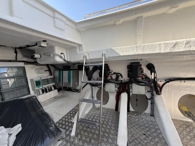 Slide: The Image of Engine room of 2025 Fjord 41 XP yacht with ladder and equipment. - 26