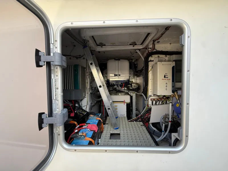 Slide: The Image of Engine compartment of 2025 Fjord 41 XP boat, showcasing internal components and wiring. - 29