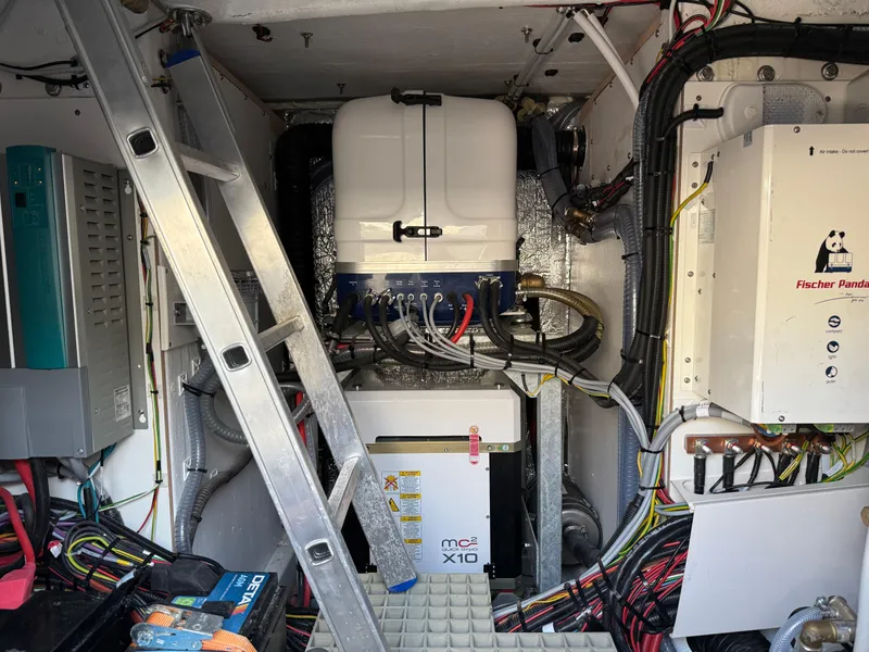 Slide: The Image of Engine room of 2025 Fjord 41 XP yacht with electrical systems and wiring. - 30
