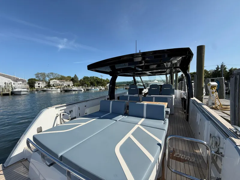 Slide: The Image of 2025 Fjord 41 XP luxury yacht docked, featuring spacious deck and modern seating. - 31