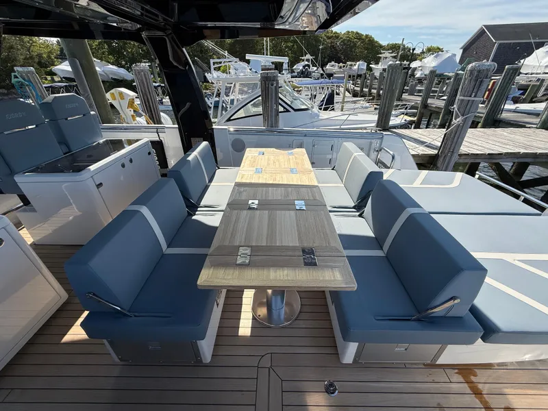 Slide: The Image of Luxury seating area on 2025 Fjord 41 XP yacht at marina. - 39