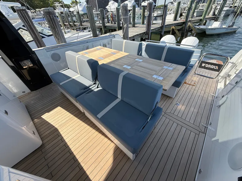 Slide: The Image of Luxurious seating area on 2025 Fjord 41 XP yacht, docked at marina. - 41