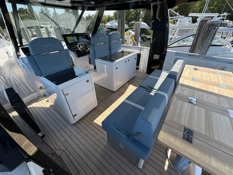 Slide: The Image of Luxurious 2025 Fjord 41 XP yacht interior with sleek seating and modern navigation controls. - 42