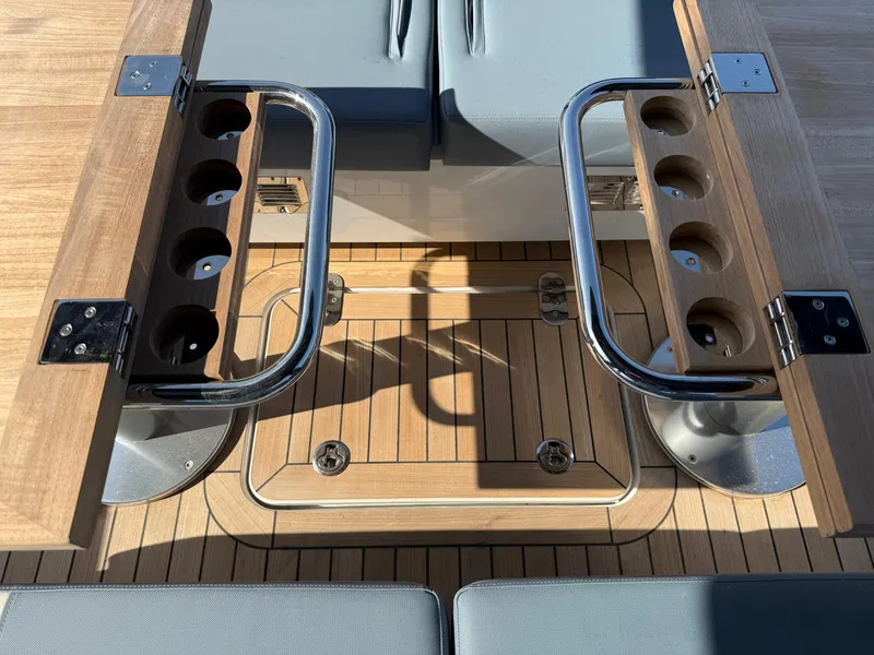 Slide: The Image of 2025 Fjord 41 XP yacht interior with wooden deck and seating area. - 49