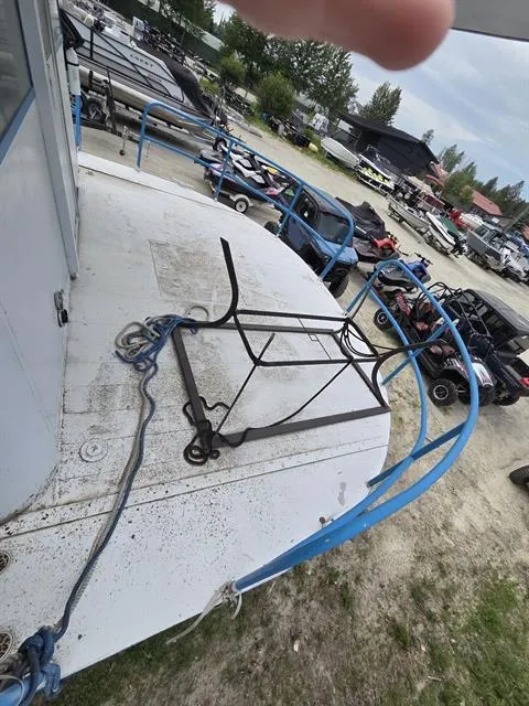 Slide: The Image of 1984 King's Craft Coastal Cruiser boat deck with blue railings and outdoor furniture. - 15