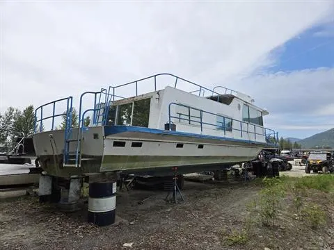 Slide: The Image of 1984 King's Craft Coastal Cruiser boat on land, supported by barrels and jacks, under a cloudy sky. - 7