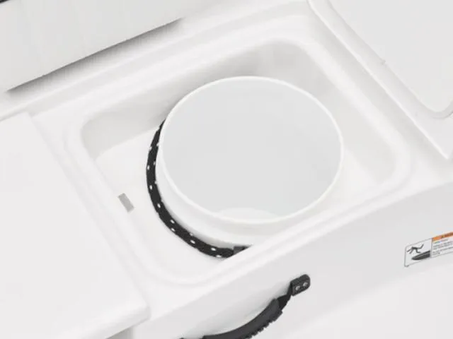 Slide: The Image of 2025 Yamaha Boats 195 FSH Sport storage compartment with a white bucket inside. - 7