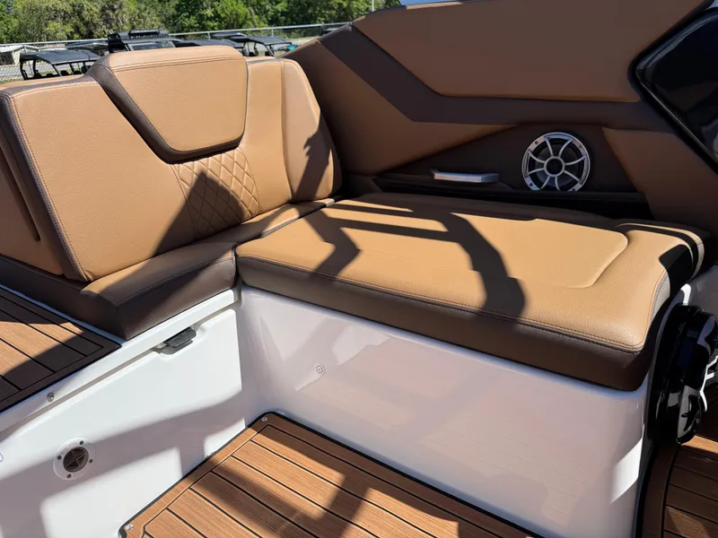 Slide: The Image of 2025 Yamaha Boats 252S interior with tan seating and wood accents. - 31