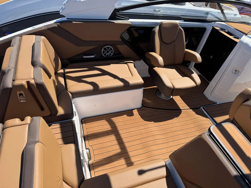 Slide: The Image of 2025 Yamaha Boats 252S interior with brown seating and sleek design. - 8