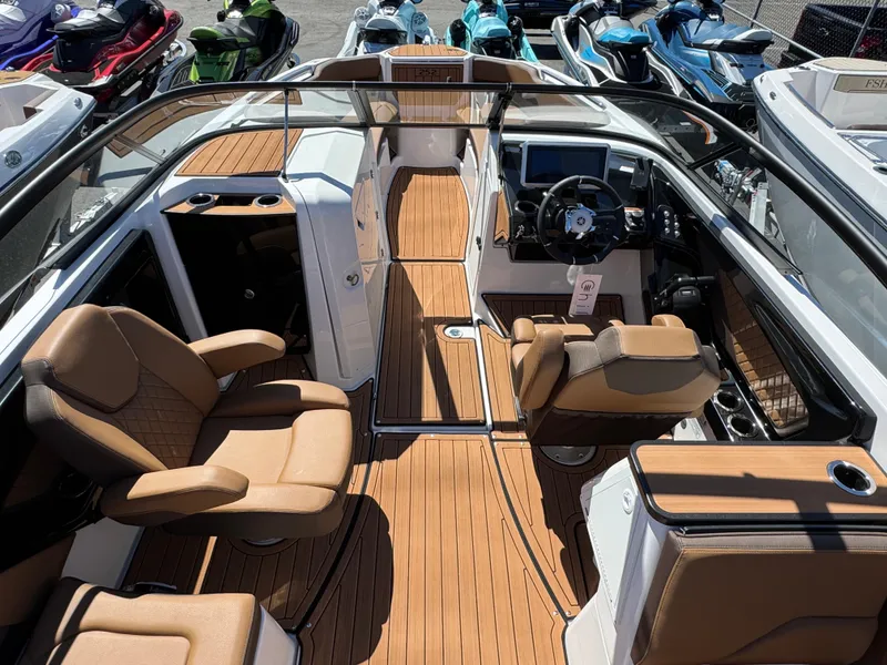 Slide: The Image of 2025 Yamaha Boats 252S interior with tan seating and sleek design. - 9