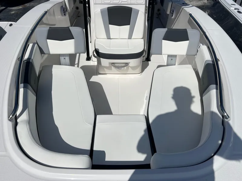 Slide: The Image of 2025 Robalo R200 Center Console boat interior with white seating and modern design. - 14