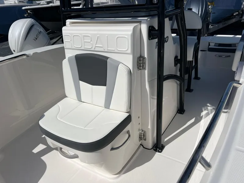 Slide: The Image of 2025 Robalo R200 Center Console boat interior with cushioned seating and storage. - 16