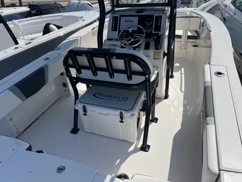 Slide: The Image of 2025 Robalo R200 Center Console boat interior with steering console and seating. - 8
