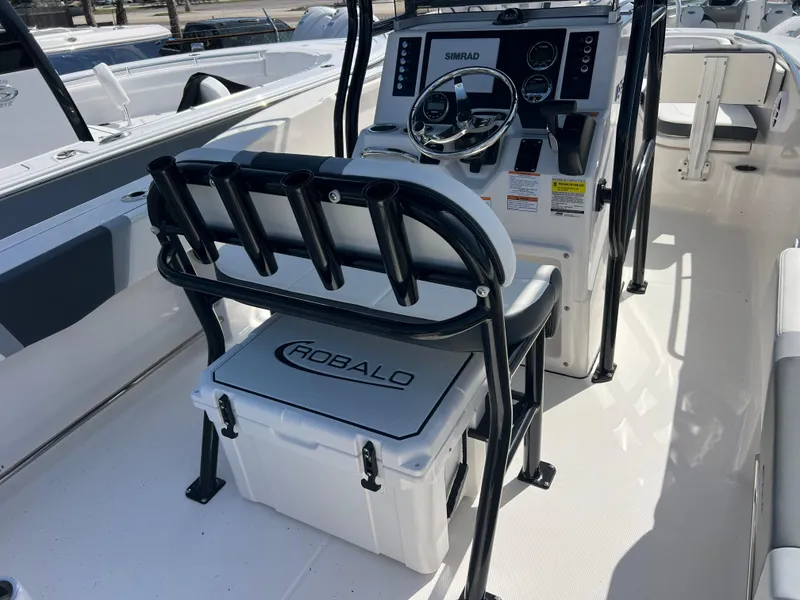 Slide: The Image of 2025 Robalo R200 Center Console boat interior with steering wheel and seating. - 9