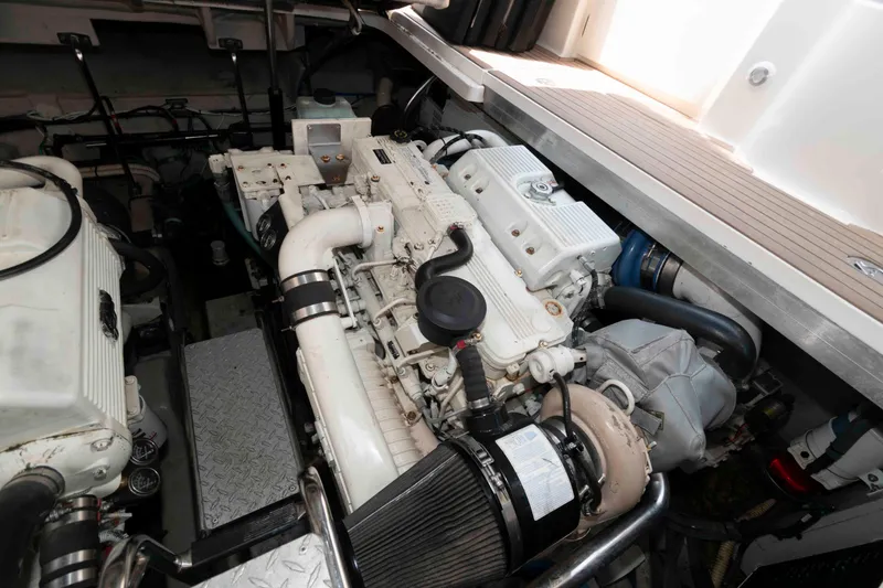Slide: The Image of Engine room of 2007 Sea Ray 44 Sundancer yacht, showcasing dual engines and mechanical components. - 22