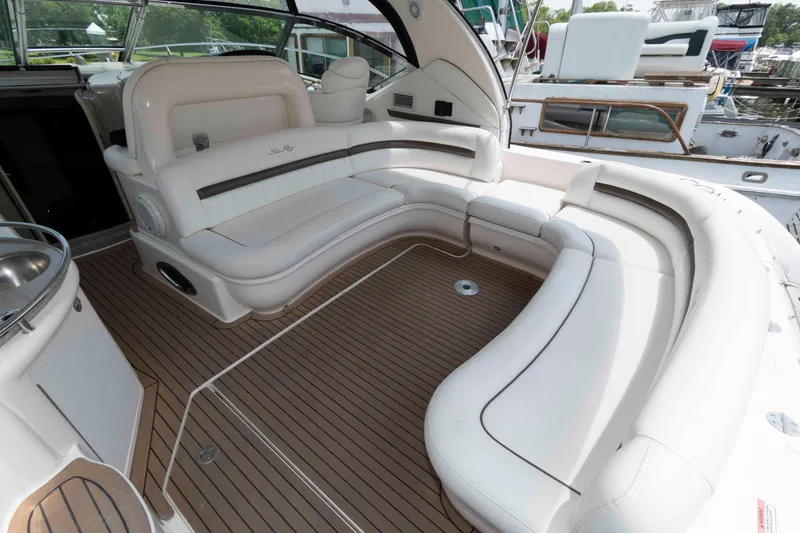 Slide: The Image of 2007 Sea Ray 44 Sundancer yacht docked, featuring spacious deck and sleek design. - 3