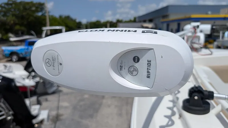 Slide: The Image of Minn Kota Riptide motor on 2016 Sailfish 275 DC boat, outdoor setting. - 16