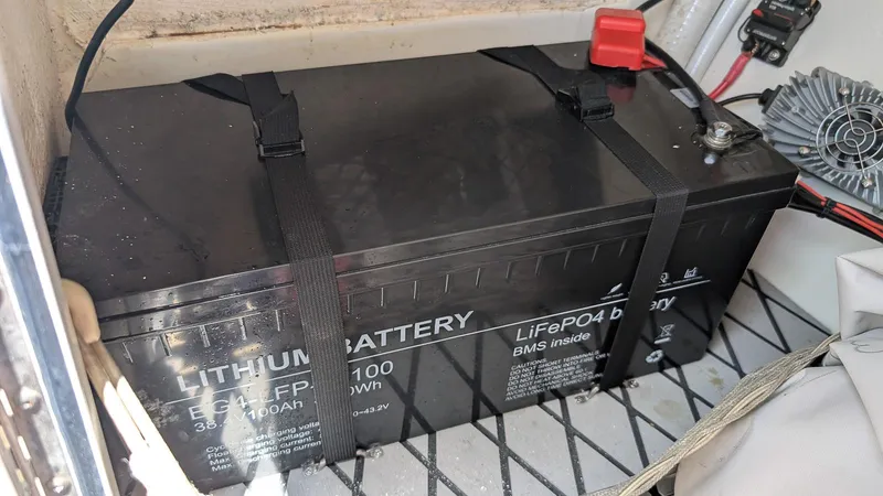 Slide: The Image of Lithium battery in 2016 Sailfish 275 DC boat, secured with straps. - 18