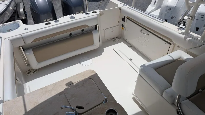 Slide: The Image of 2016 Sailfish 275 DC boat interior with seating and storage compartments. - 6