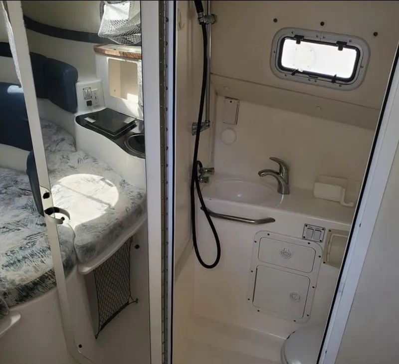 Slide: The Image of Interior of a 2000 Century 3200 WA boat with bed and compact bathroom. - 16