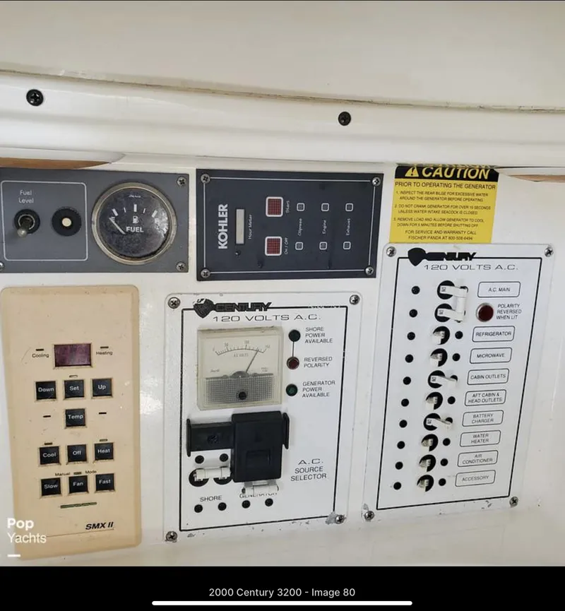 Slide: The Image of Control panel of a 2000 Century 3200 WA boat with various gauges and switches. - 18