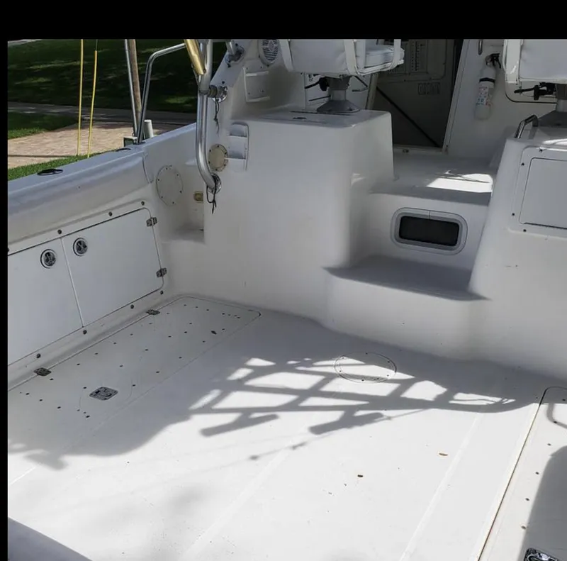 Slide: The Image of Interior view of a 2000 Century 3200 WA boat, featuring a clean, white deck. - 7