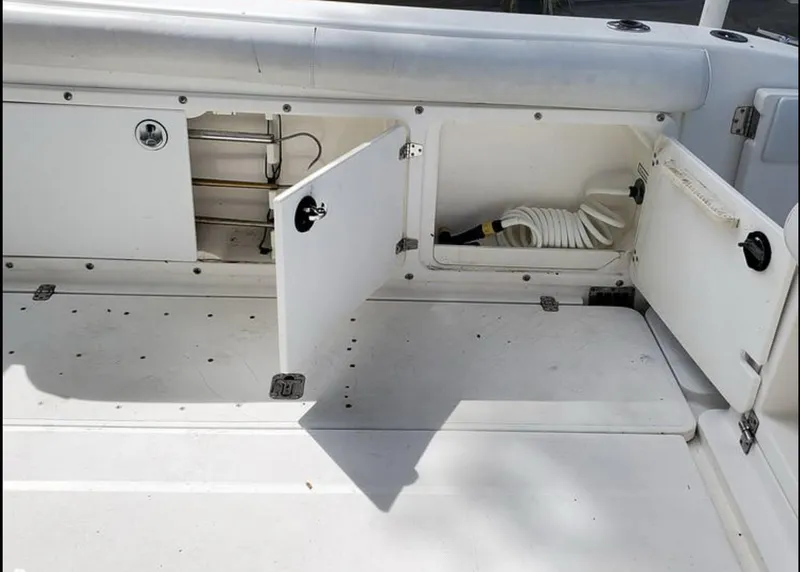 Slide: The Image of Open storage compartments on a 2000 Century 3200 WA boat deck. - 9