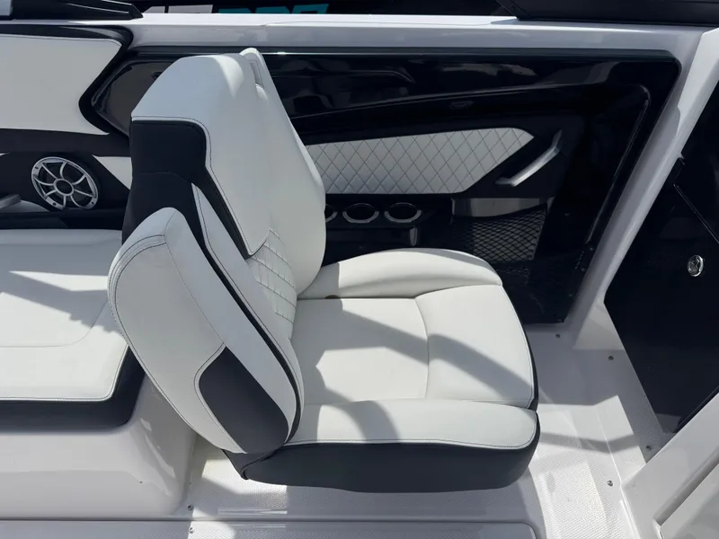 Slide: The Image of 2025 Yamaha Boats 252S interior seat with black and white upholstery, featuring modern design elements. - 11