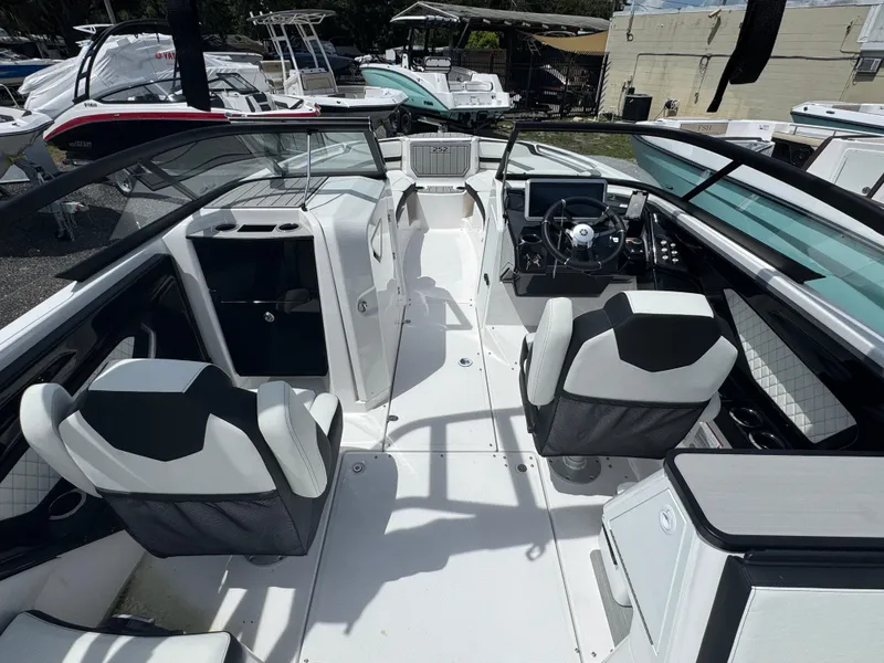 Slide: The Image of 2025 Yamaha Boats 252S interior with modern seating and sleek dashboard design. - 5