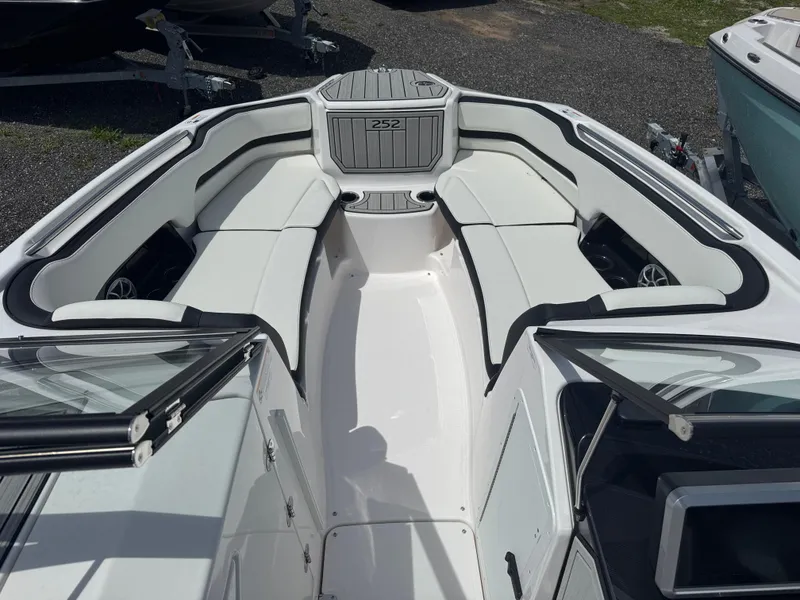 Slide: The Image of 2025 Yamaha Boats 252S interior with white seating and sleek design. - 6
