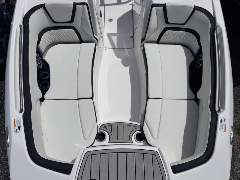 Slide: The Image of 2025 Yamaha Boats 252S interior with sleek white seating and modern design. - 8