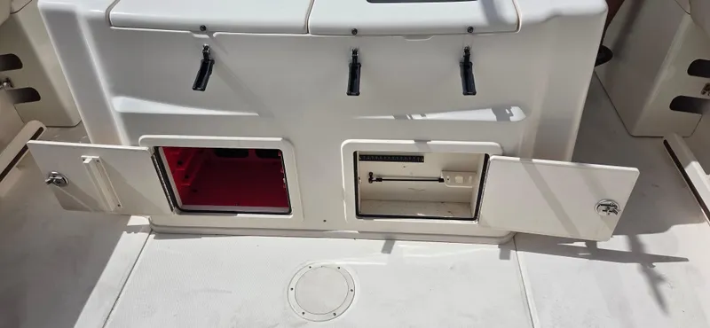 Slide: The Image of 2016 Grady-White Canyon 306 boat storage compartments open on deck. - 10