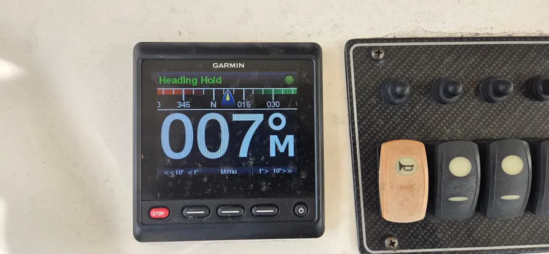 Slide: The Image of Garmin navigation display on 2016 Grady-White Canyon 306 boat, showing heading 007°M. - 14