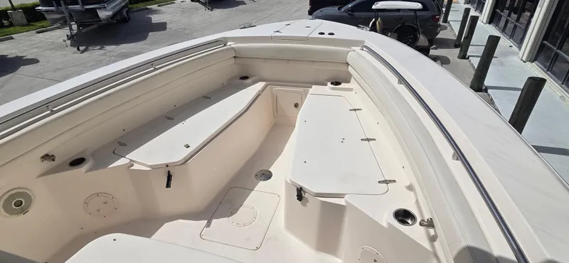 Slide: The Image of 2016 Grady-White Canyon 306 boat interior, showcasing spacious seating and storage areas. - 23