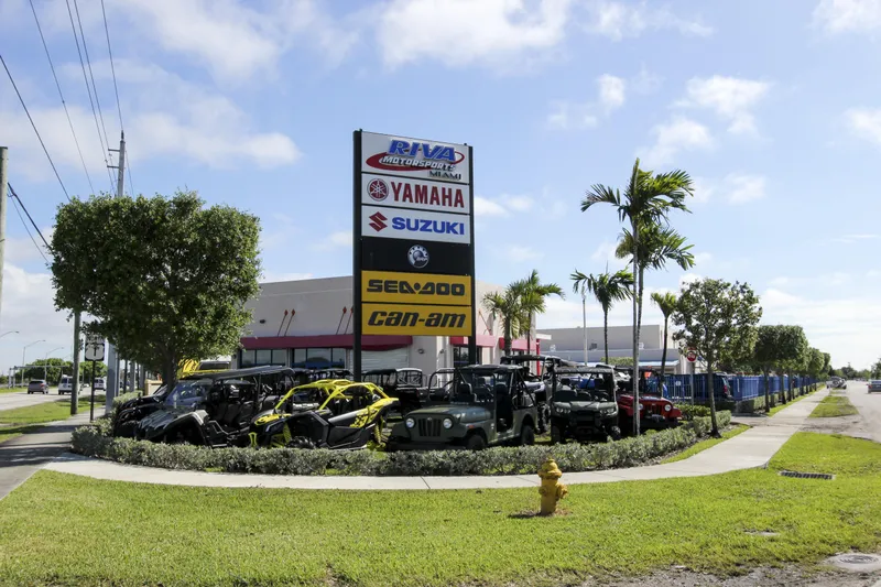 Slide: The Image of Outdoor dealership display with Yamaha, Suzuki, Sea-Doo, and Can-Am signage, featuring various vehicles. - 21