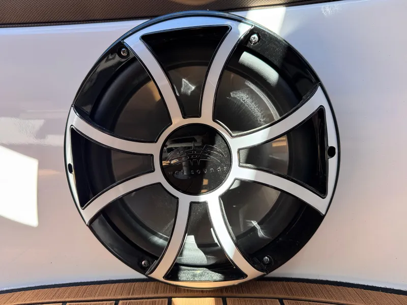 Slide: The Image of Close-up of a Yamaha Boats 252S 2025 speaker with sleek black and silver design. - 14