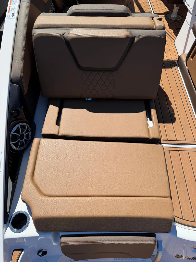 Slide: The Image of 2025 Yamaha Boats 252S interior seating with brown upholstery and sleek design. - 5