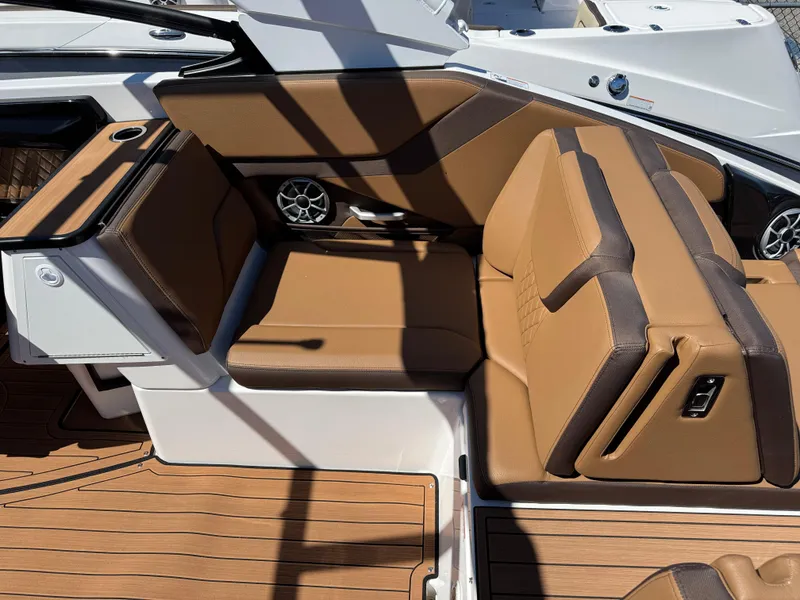 Slide: The Image of 2025 Yamaha Boats 252S interior with tan leather seating and modern design. - 7